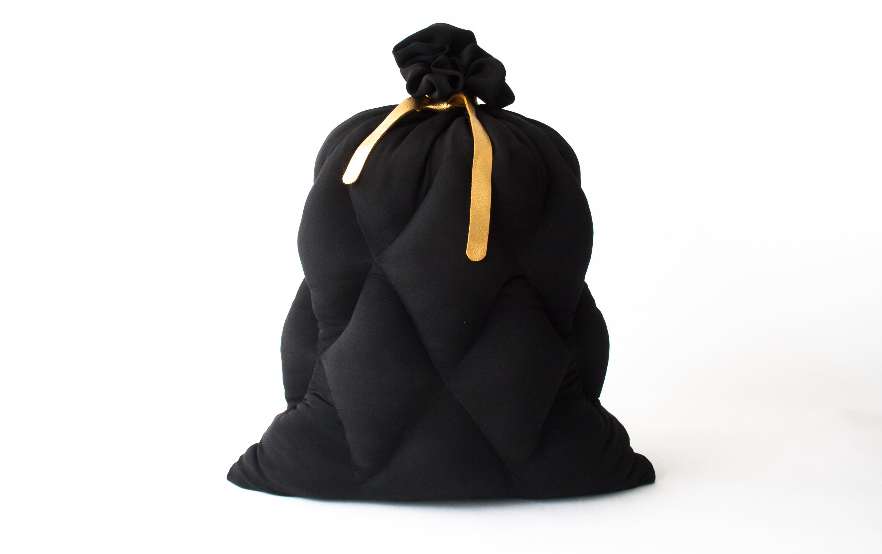 Limited Garbage, a limited edition silk pillow in the shape of a garbage bag, designed by Jarle Veldman